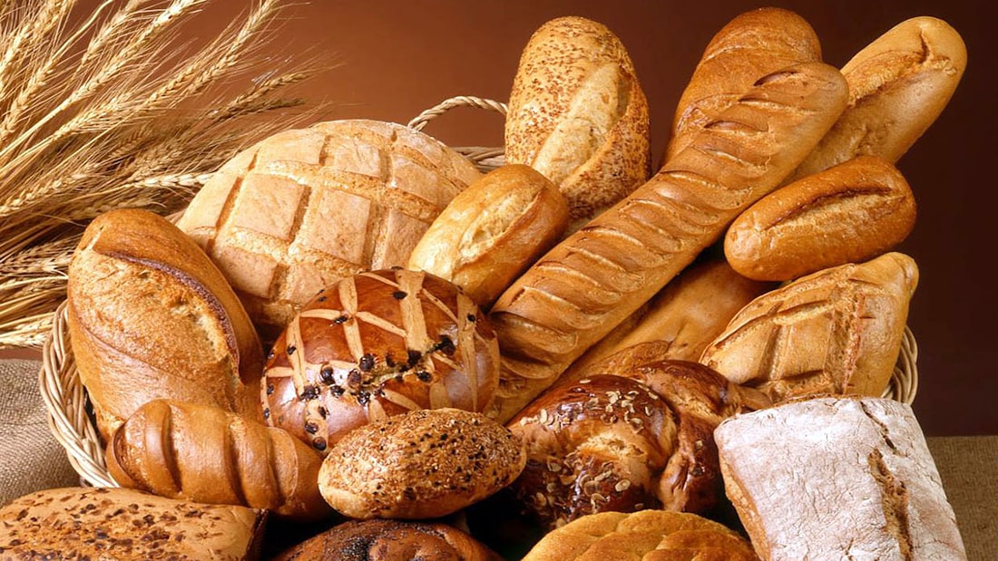 A basket filled with freshly baked loaves and rolls