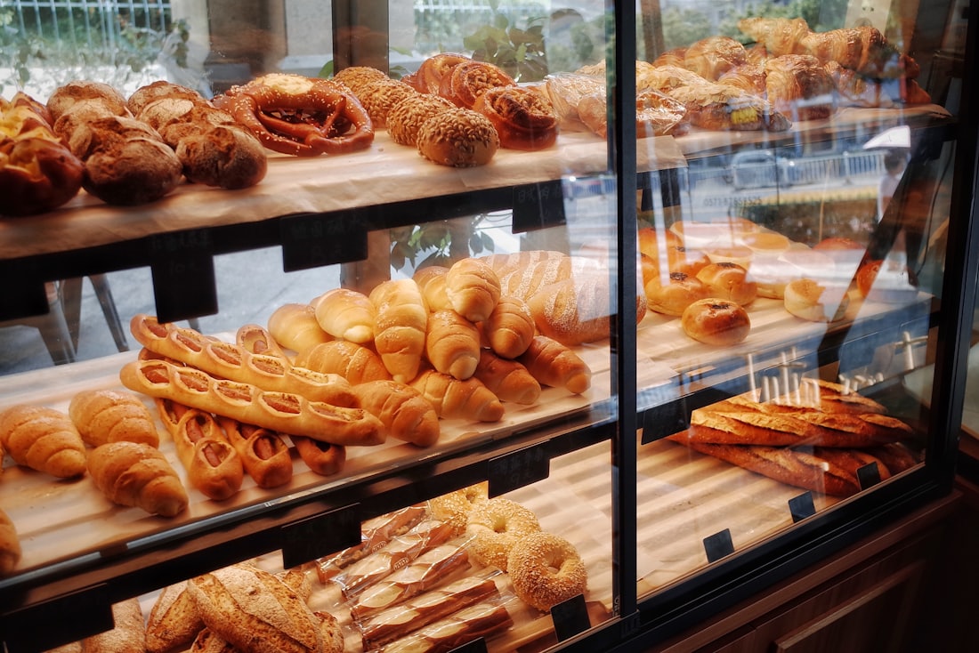 A glass cabinet filled with fresh pastries