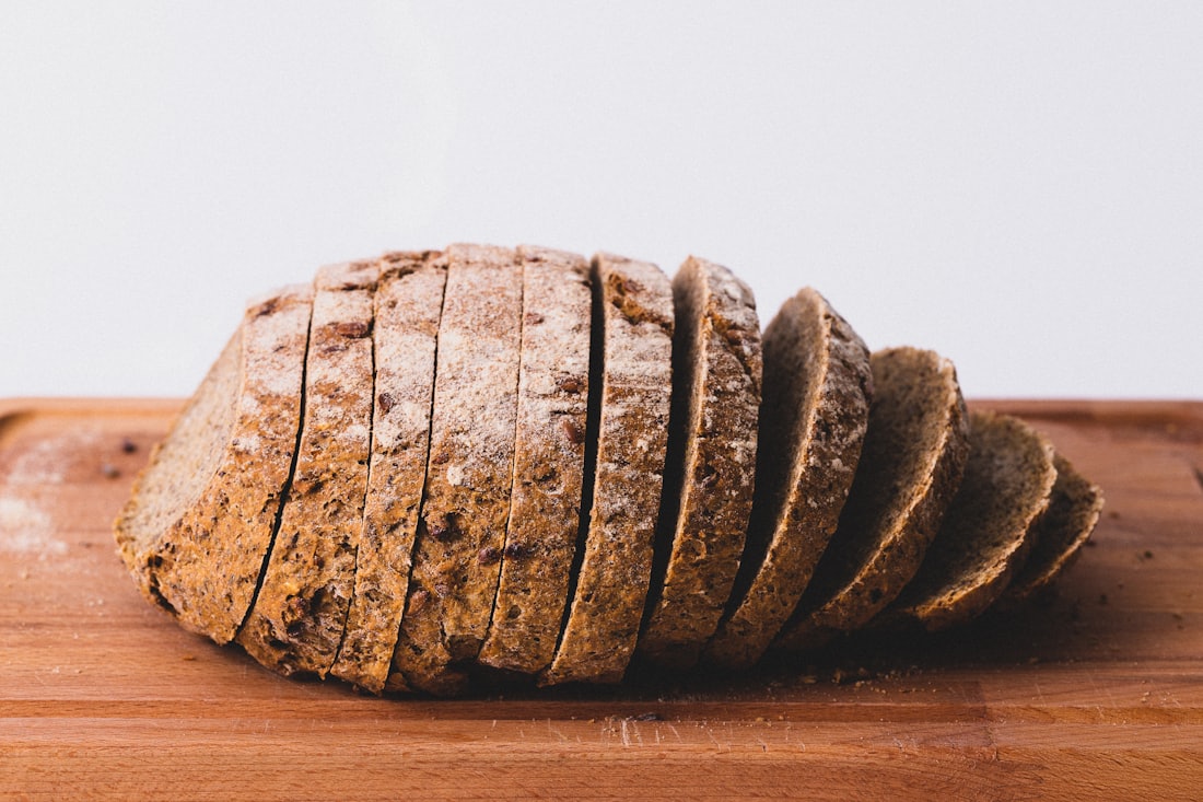 A rustic loaf sliced on a wooden board